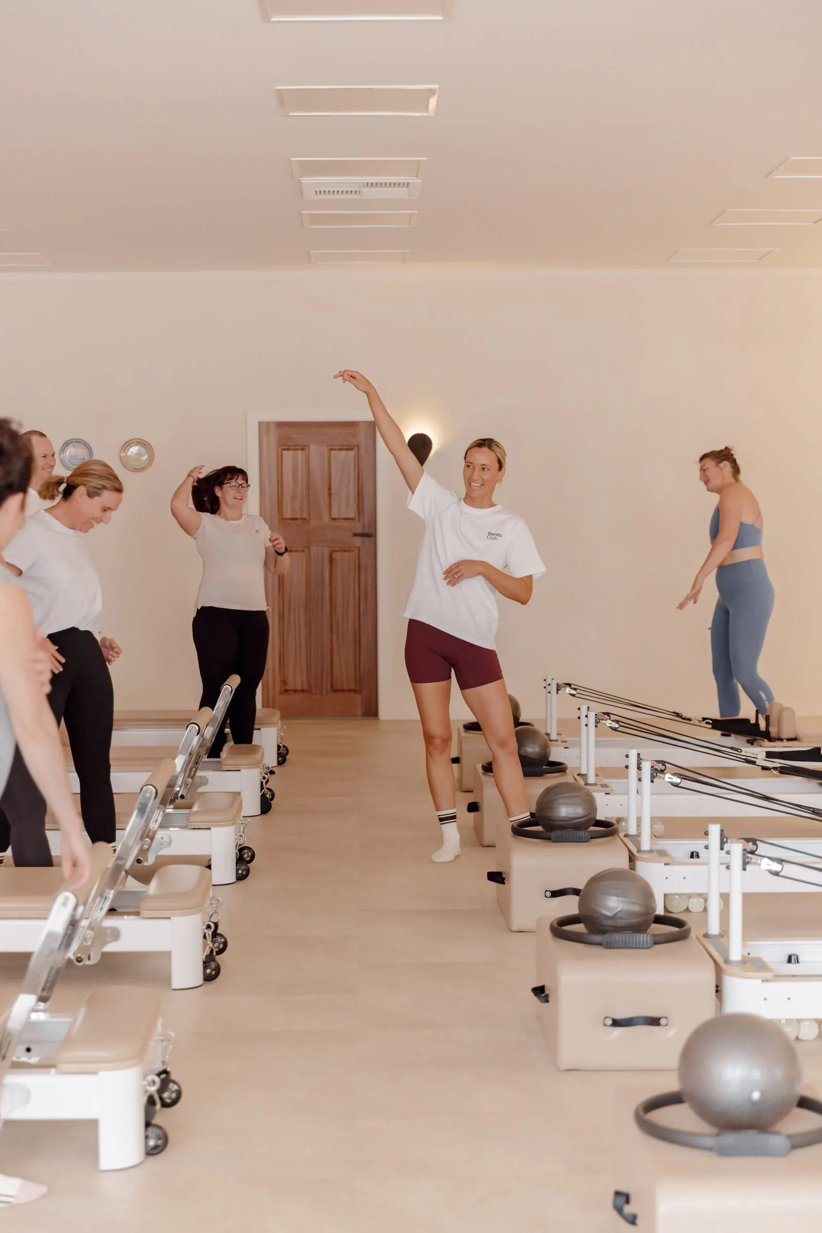 An instructor leading a class at Sento Club